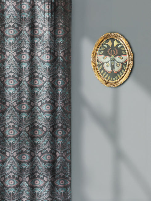 Sheer curtain panel featuring repeating sage green and blush pink evil eye motif surrounded by botanical elements on dark gray background. Linen-textured polyester fabric allows filtered light while providing elegant window covering with protective symbolism for Victorian or gothic interiors.